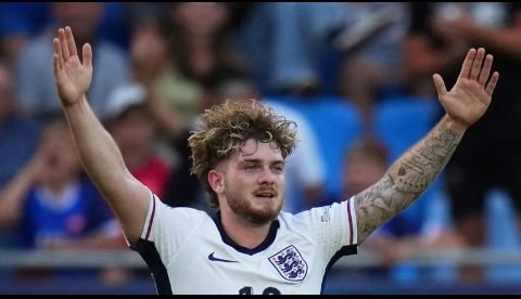 Harvey Elliott celebrating a goal for England U21, showcasing determination and team spirit.