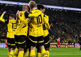 Real Madrid vs Borussia Dortmund players celebrating during a match