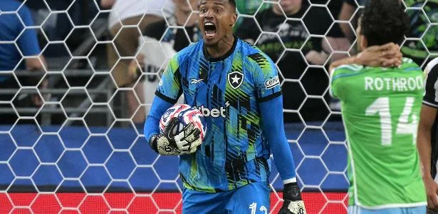 Man United Botafogo goalkeeper John Victor celebrates after making a crucial save during a match.
